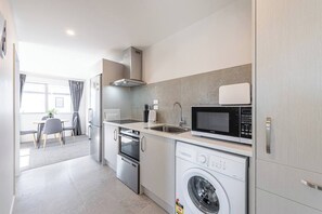Coffee/tea maker, fridge, microwave, oven