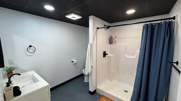 Shower, eco-friendly toiletries, hair dryer, towels