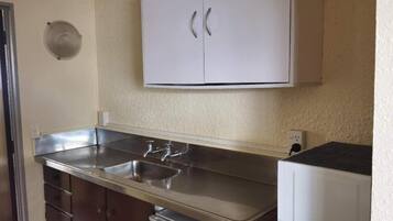 Family Room | Private kitchen | Full-size fridge, microwave, stovetop, cookware/dishes/utensils