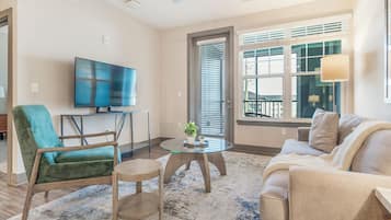Apartment, 1 Bedroom | Living area | 40-inch TV with digital channels