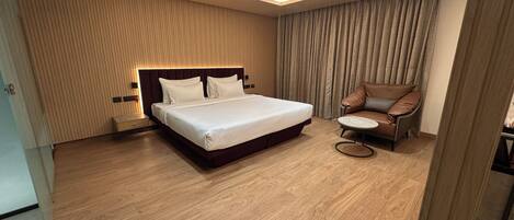 Desk, laptop workspace, bed sheets