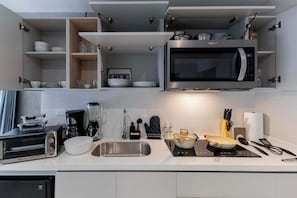 Fridge, microwave, stovetop, coffee/tea maker