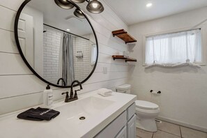 Shower, hair dryer, towels, shampoo