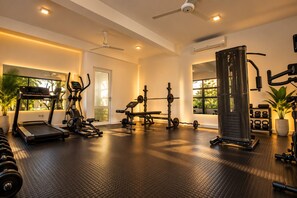 A gym with treadmills, weight machines, and free weights. - Lake Villas Premium Kandy (Kandy)
