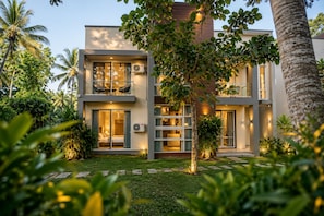 A modern two-story building with balconies, large windows, and a well-maintained garden. - Lake Villas Premium Kandy (Kandy)