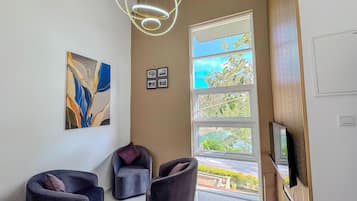 Standard Villa, Garden View | Living area | TV