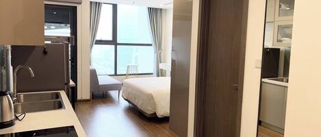 Apartment, 1 King Bed, Balcony | Living area | 55-inch flat-screen TV with cable channels, Netflix, streaming services