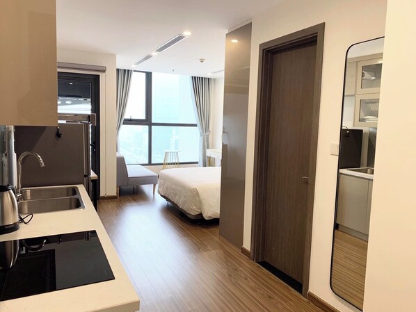 Apartment, 1 King Bed, Balcony | Living area | 55-inch flat-screen TV with cable channels, Netflix, streaming services