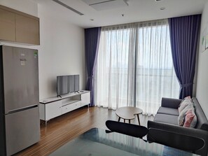 Apartment, 2 Bedrooms, City View | Living area | 55-inch flat-screen TV with cable channels, Netflix, streaming services