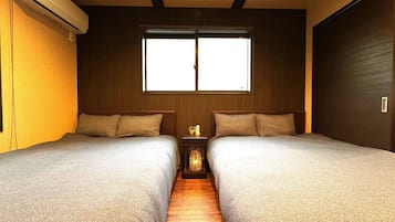 Hypo-allergenic bedding, desk, laptop workspace, blackout curtains