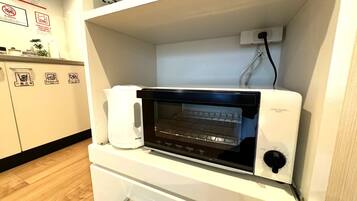 Hypo-allergenic bedding, desk, laptop workspace, blackout curtains