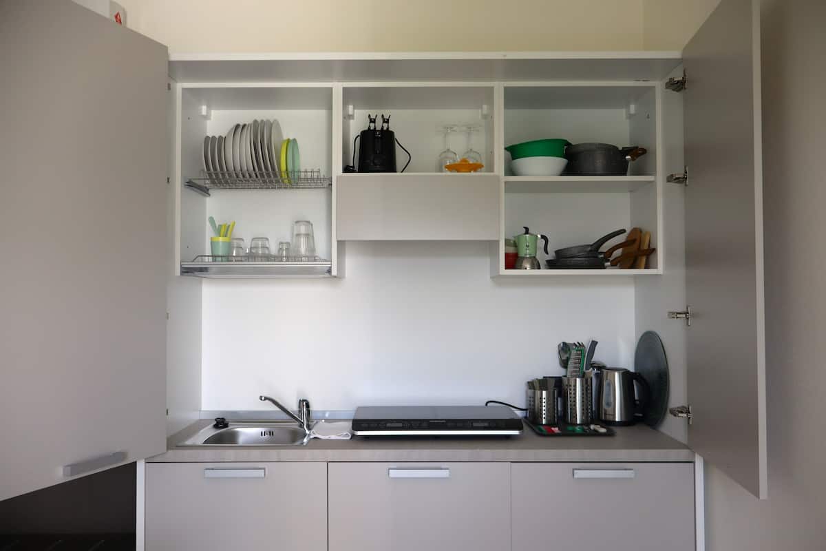 Mini-fridge, stovetop, dishwasher, espresso maker