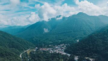 A mountainous landscape with a small town nestled in a valley.