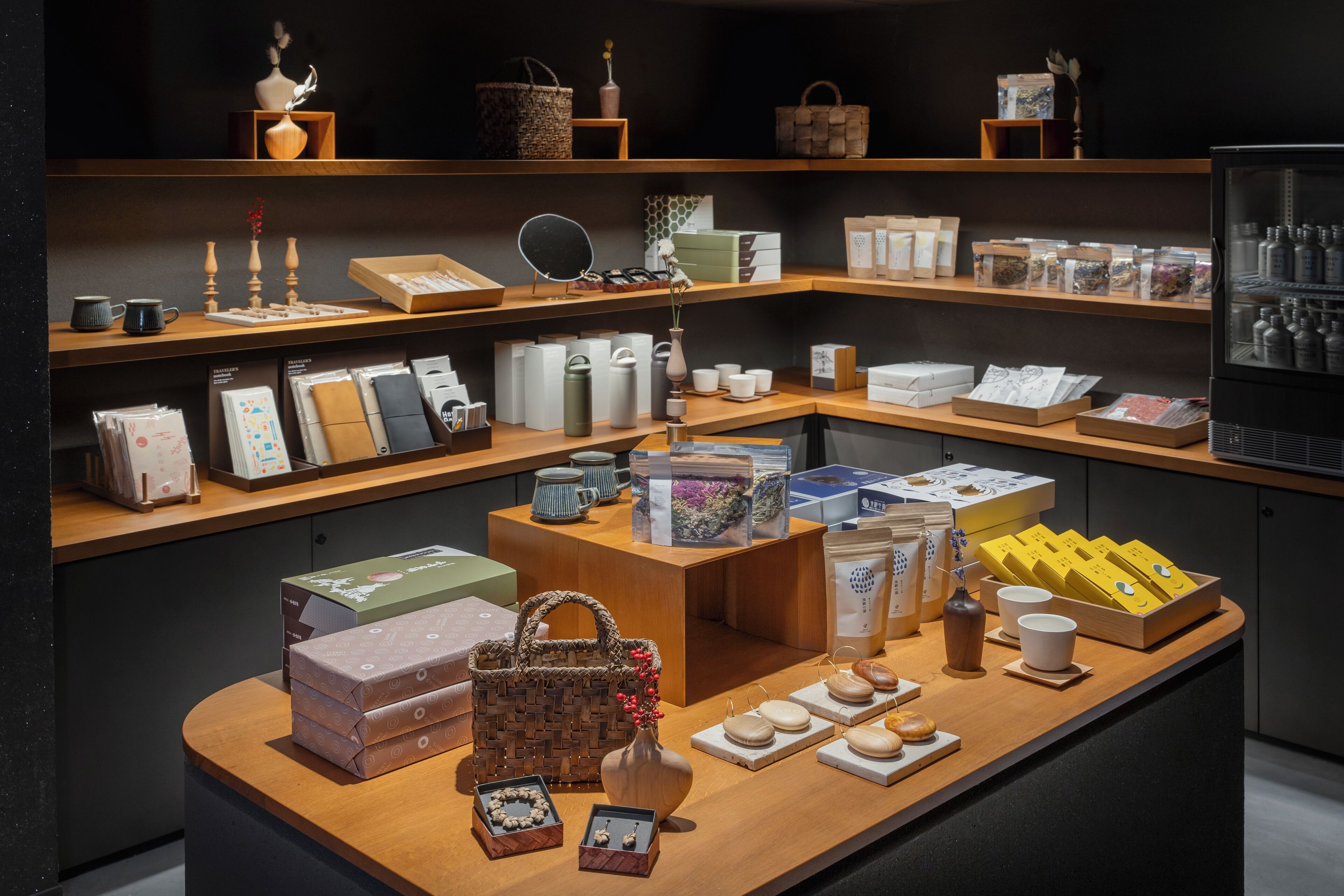 A display of various home decor items including vases, candles, and storage boxes.