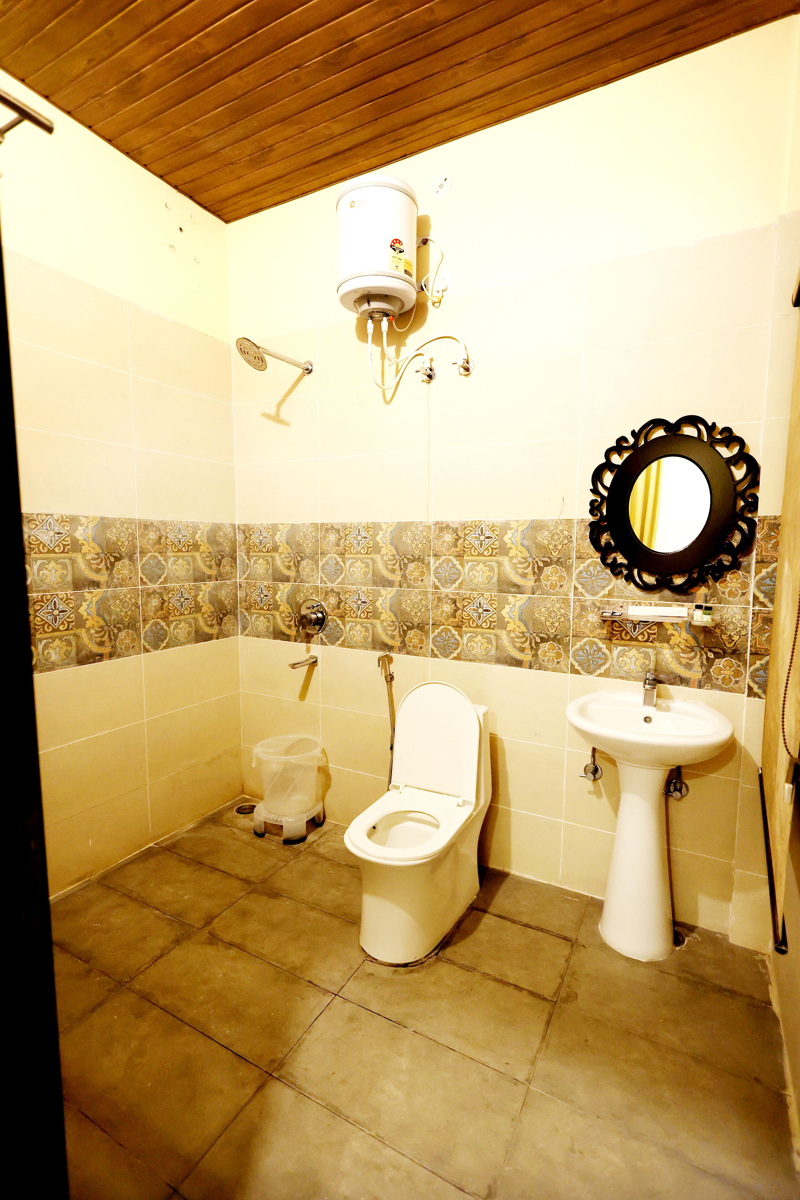 A bathroom with a toilet, sink, and shower.