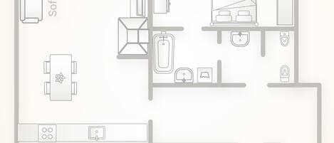 A floor plan of a hotel room with a sofa-bed, a dining table, a kitchen area, and a closet.