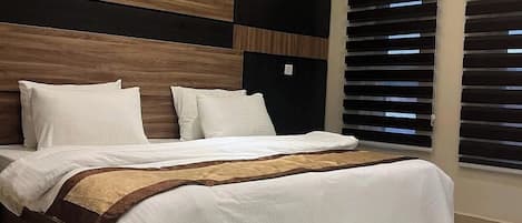 Family Room, Balcony, City View | Desk, laptop workspace, blackout drapes, soundproofing