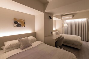 Executive Apartment, City View | Desk, laptop workspace, blackout drapes, iron/ironing board