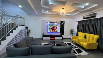 Economy Apartment, Balcony, City View | Living area | Flat-screen TV