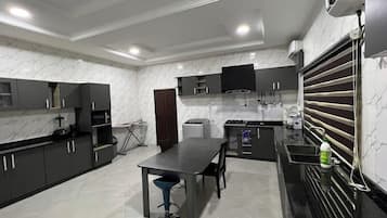 Economy Apartment, Balcony, City View | Private kitchen | Fridge, microwave, oven, stovetop