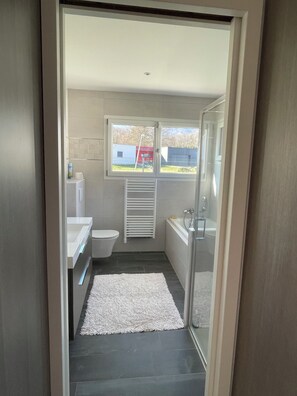 Shower, eco-friendly toiletries, hair dryer, towels