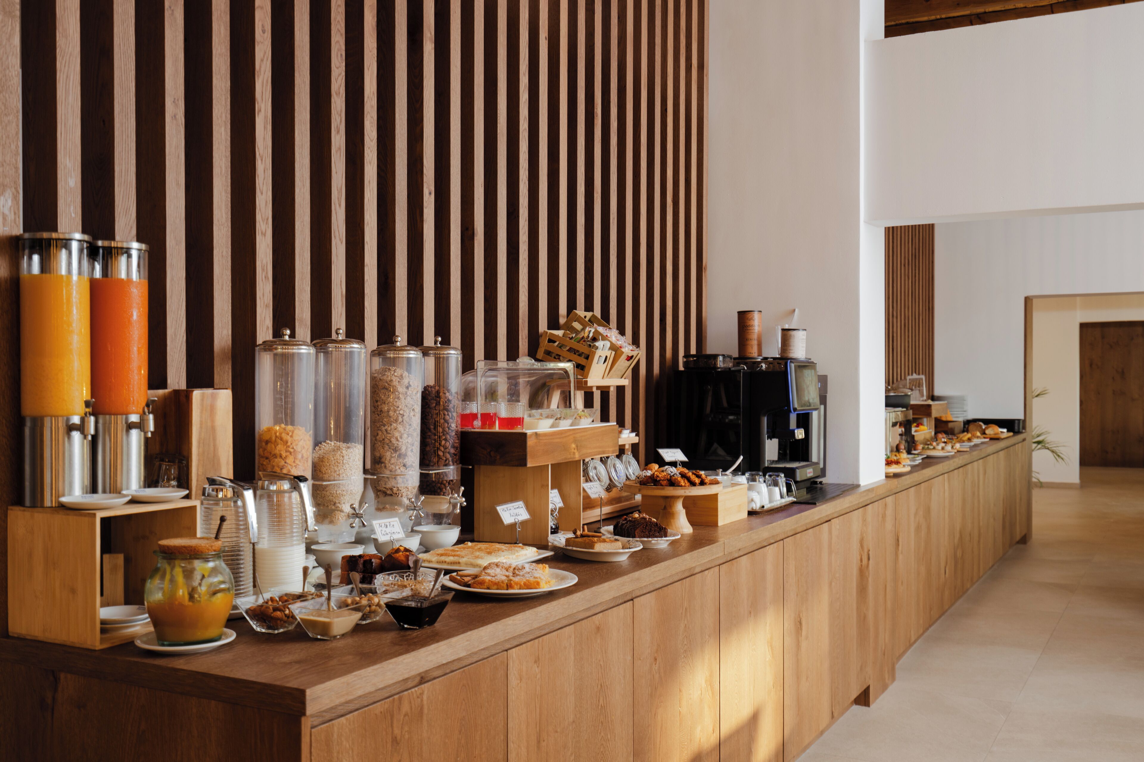 A breakfast buffet with various food items and beverages.