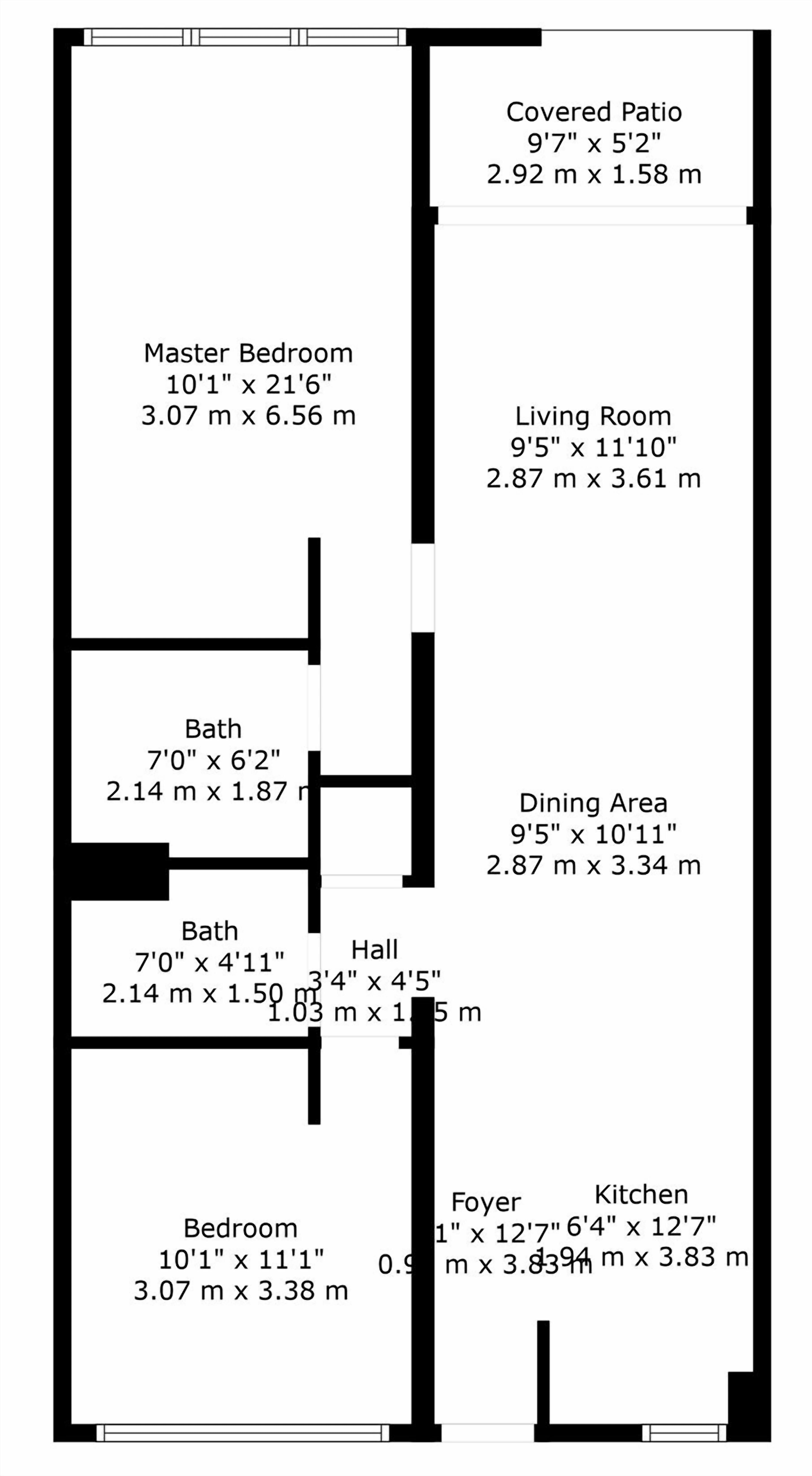 Un plan d’étage comprenant une chambre principale, un salon, un coin repas, une terrasse couverte, deux salles de bain, un hall d’entrée et une cuisine.