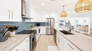 Coffee/tea maker, fridge, microwave, oven
