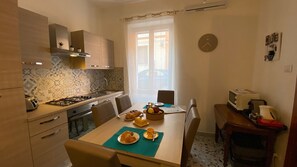 Apartment, 2 Bedrooms | Dining room - Elegant Three Room Apartment in Porto Torres (Porto Torres)