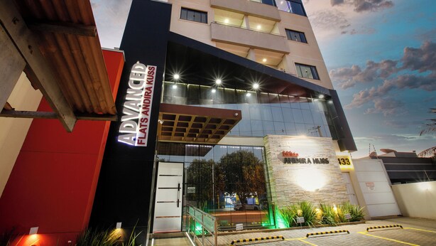 A hotel entrance with a modern design, featuring a glass facade and illuminated signage. - FLATS ANDIRA KUSS (Sinop)