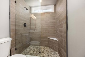 Shower, hair dryer, towels, shampoo