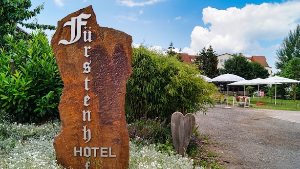 A rustic hotel sign with the name 'Fürstenhof' in a natural stone. - Fürstenhof Landgasthaus und Hotel (Erfurt)