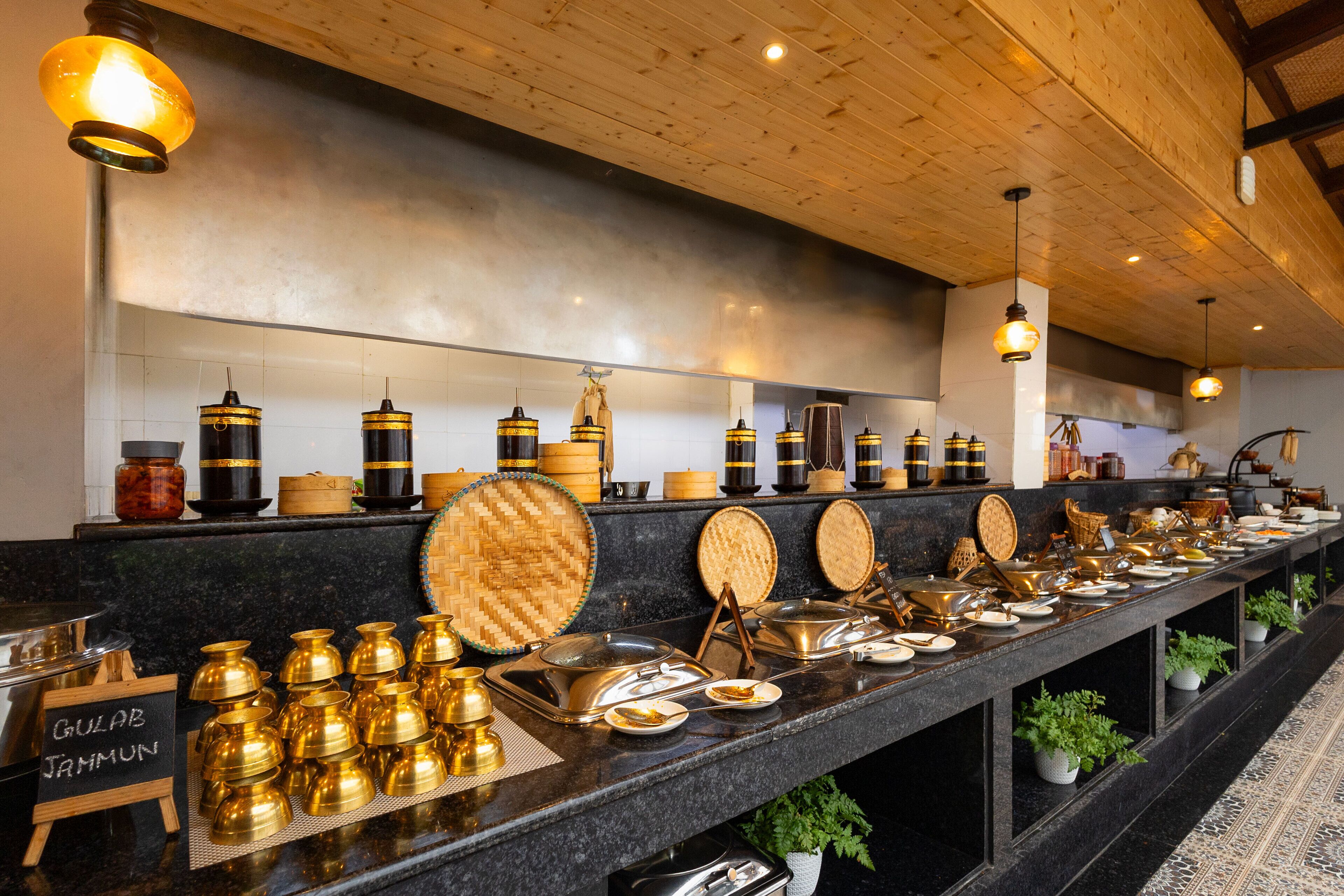 A buffet setup with various serving dishes and containers.