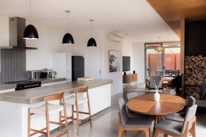 Enjoy meals and socializing in this well-lit kitchen with a central island and dining area.