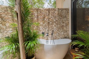 Shower, hair dryer, towels, shampoo