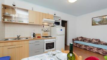 Family Apartment, Multiple Bedrooms (Lopar Escape) | Private kitchen | Fridge, microwave, oven, stovetop