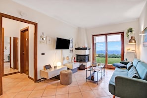 Family Apartment, 2 Bedrooms, Microwave, Mountainside (Lakeview Bliss / pool & fenced Garden) | Living area | Smart TV - Lakeview Bliss / Pool & Fenced Garden (Villanuova sul Clisi)
