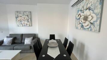 Comfort Apartment, 1 Bedroom, City View | Living area | Flat-screen TV
