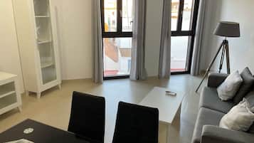Comfort Apartment, 1 Bedroom, City View | Living area | Flat-screen TV