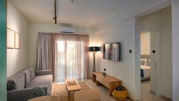 Apartment, 2 Bedrooms | Living area | 32-inch flat-screen TV with satellite channels