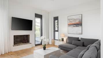 Apartment, City View | Living room | 50-inch Smart TV with satellite channels, fireplace, Netflix