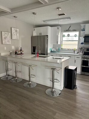 Fridge, microwave, oven, stovetop - Starfish Kisses, beautiful pool home, 8 min from beach, 12 min to speed way. (South Daytona)