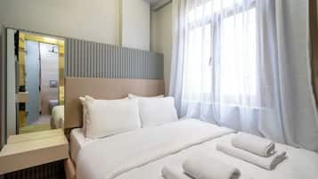 Economy Room | 1 bedroom, premium bedding, in-room safe, blackout drapes