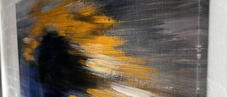 A painting on a white brick wall.