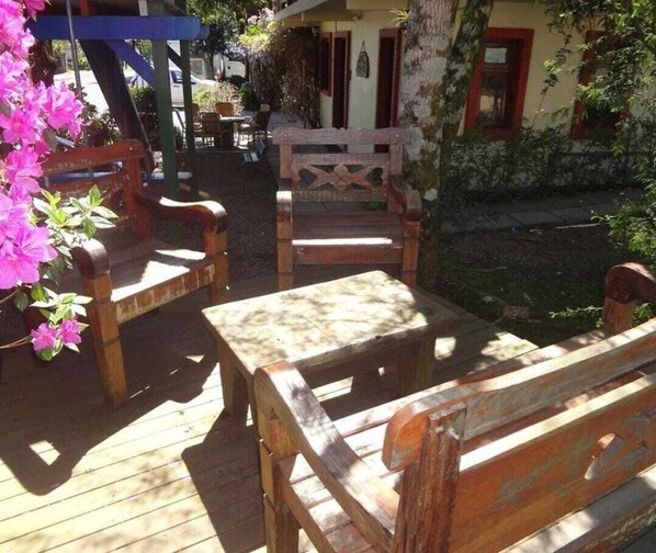 Sit and enjoy the view from this outdoor seating area with benches and a table.