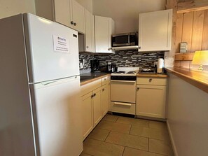 Fridge, microwave, cookware/dishes/utensils