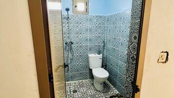 Shared Dormitory, 1 Single Bed, Vision Accessible, Non Smoking | Bathroom | Slippers, towels, soap, shampoo