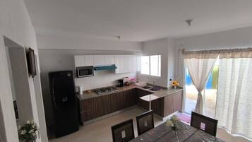 Fridge, microwave, stovetop, coffee/tea maker