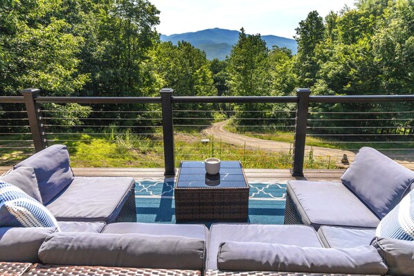 A balcony with outdoor seating and a view of a mountain. - Private, Mountain views, Close to Horse Show Grounds, Lake Placid and Hiking (Keene)