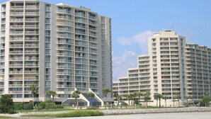 A modern hotel with multiple floors, balconies, and a central atrium. - Oceanfront 3-bedroom Condo - North Myrtle Beach (Myrtle Beach)